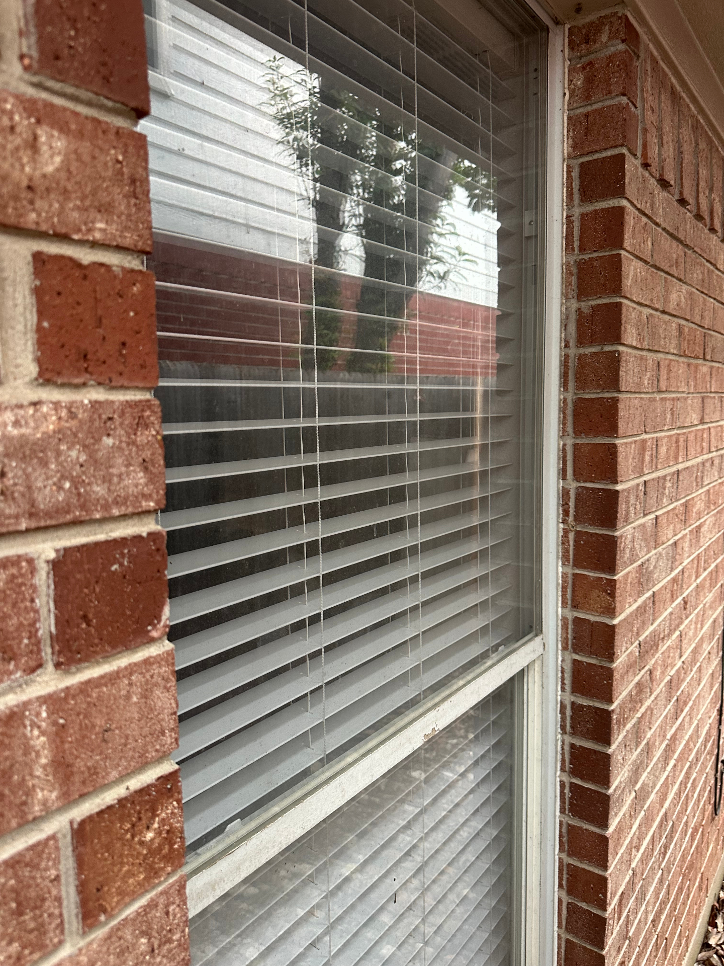 Dusty exterior window with visible grime on the glass